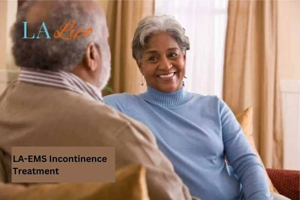 Couple sat smiling at each other - LA-EMS treatment Coventry
